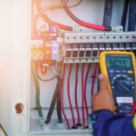 Workers,Use,Multimeter,To,Measure,The,Voltage,Of,Electrical,Wires