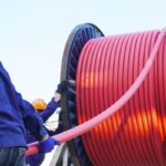 Workers,Pulling,High,Voltage,Cable,Line,Or,Large,Electric,Cable