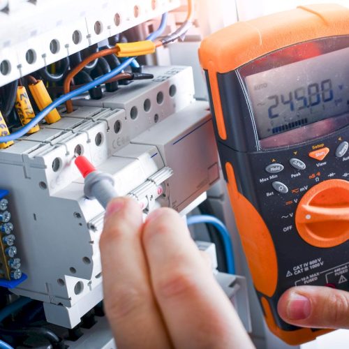 Electrician,Installing,Electric,Cable,Wires,And,Fuse,Switch,Box.,Multimeter