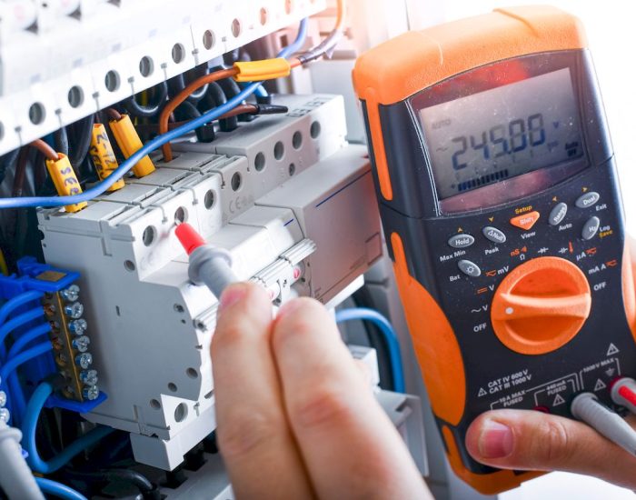 Electrician,Installing,Electric,Cable,Wires,And,Fuse,Switch,Box.,Multimeter